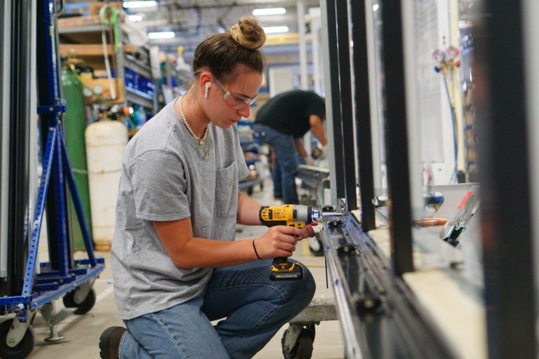 On the Job Female Mechanical Assembler Outsourced Manufacturing