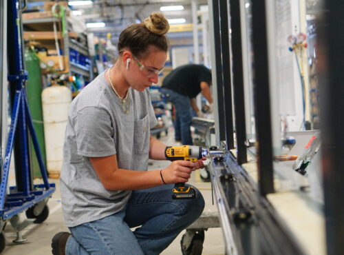 On the Job Female Mechanical Assembler Outsourced Manufacturing